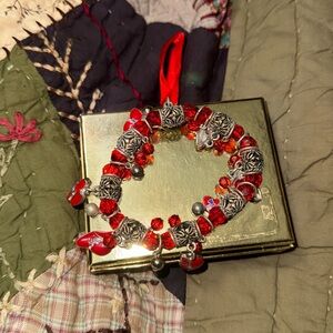 Red bracelet red hat charms